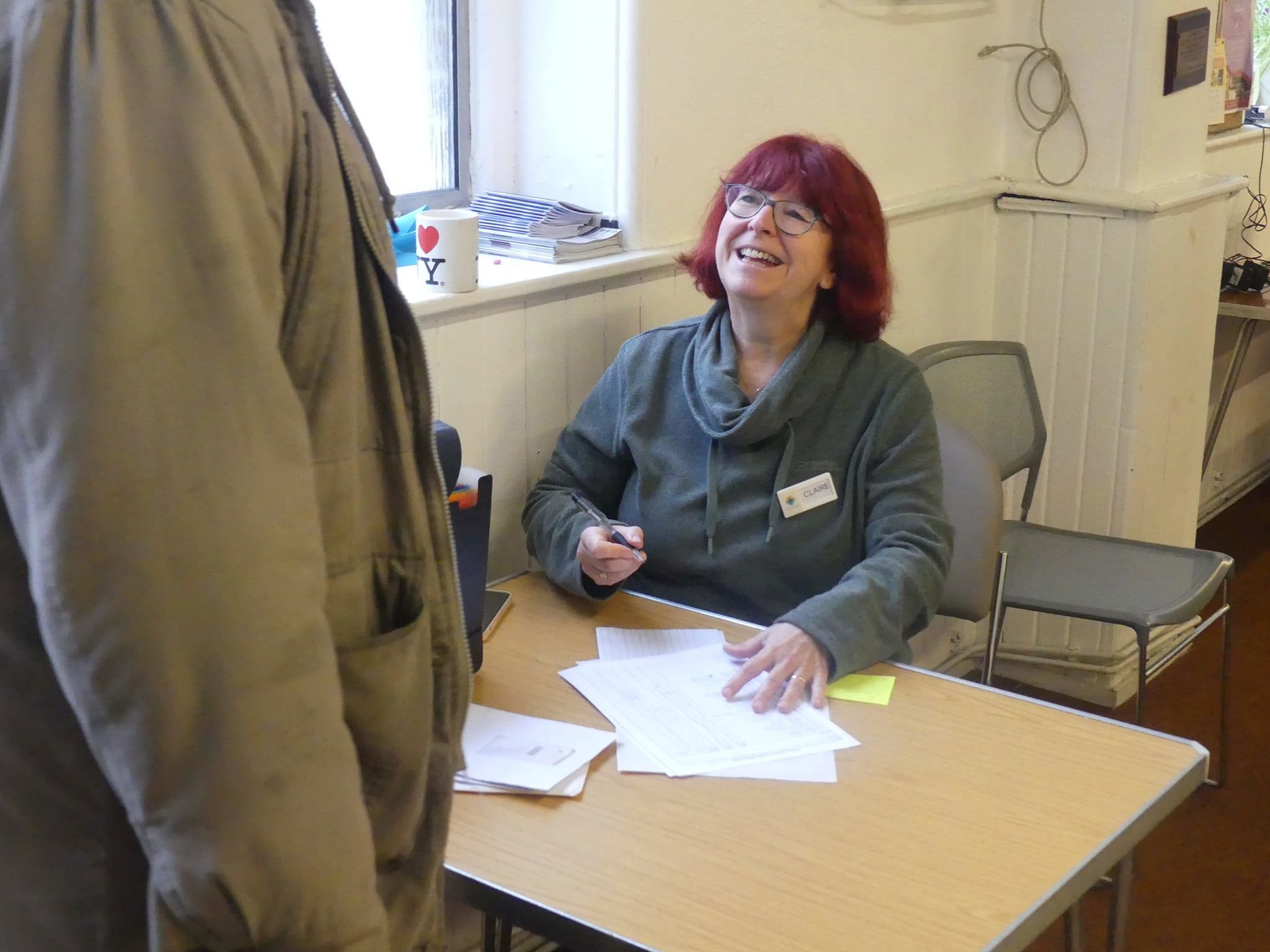 Claire on Reception welcomes a service user to the Drop-in