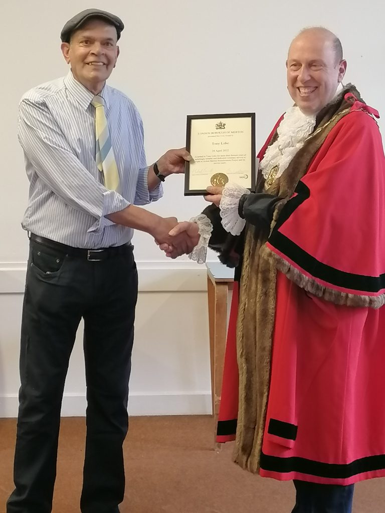 Tony Lobo receives a Merton Civic Award from Mayor of Merton Cllr Michael Brunt